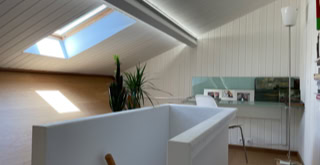 Stairwell and light-filled study under the roof.